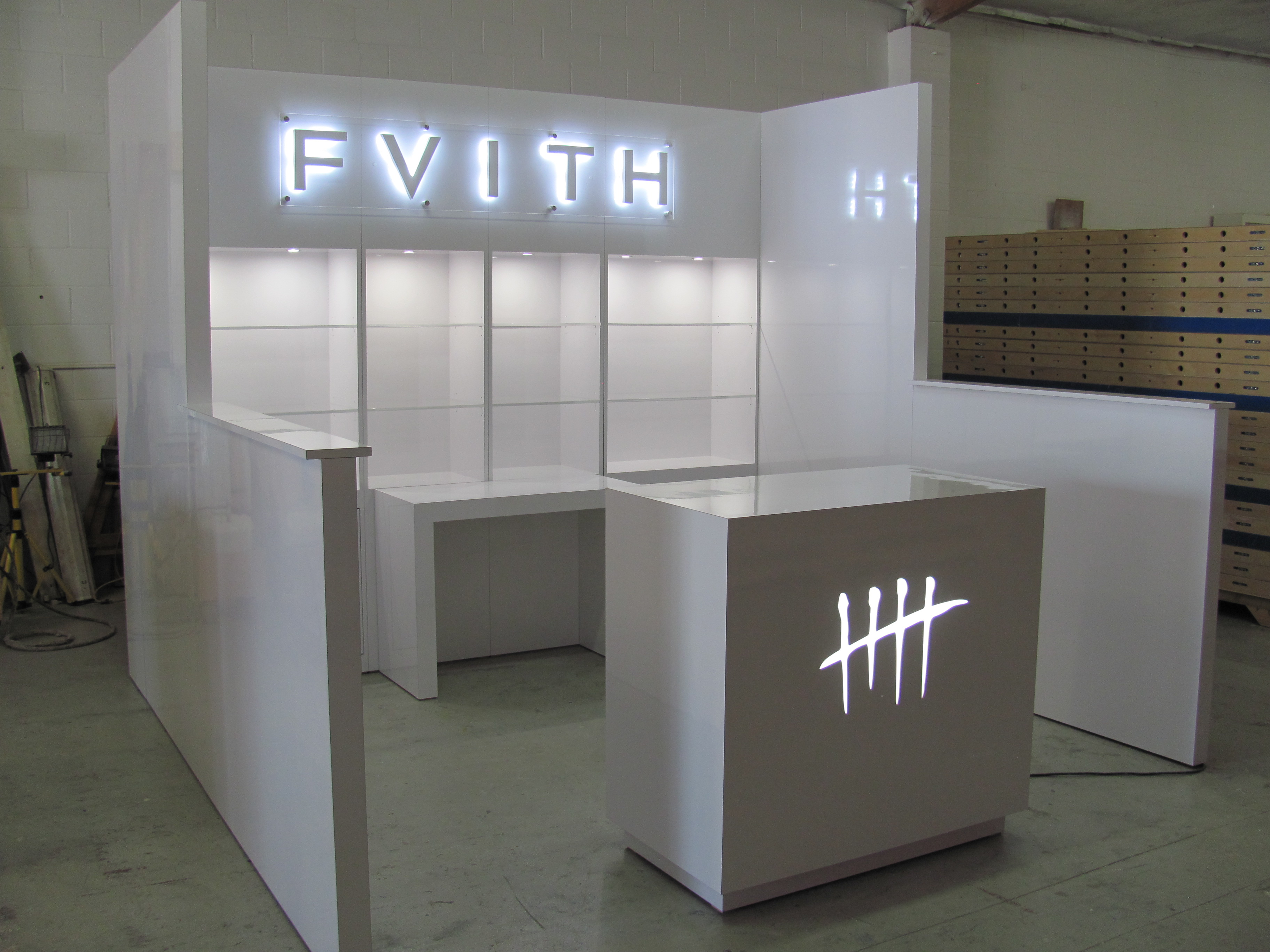 /custom-trade-show-booth-10x10-hard-wall-with-backlit-signs-1